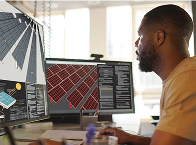 man on computer using auto cad