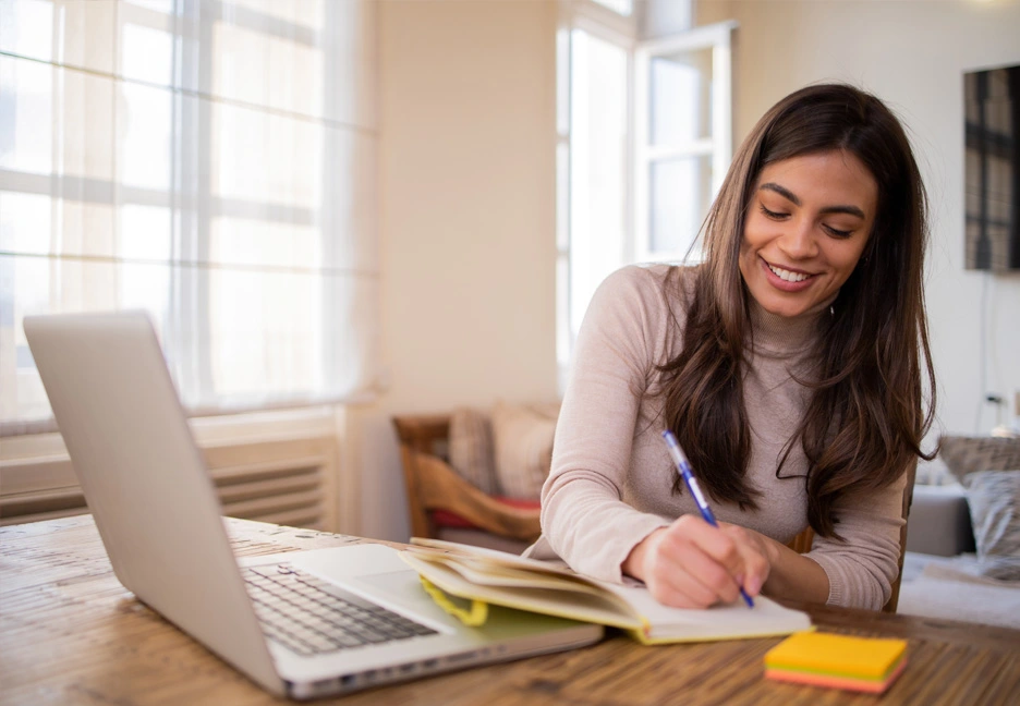 female student studying on computer