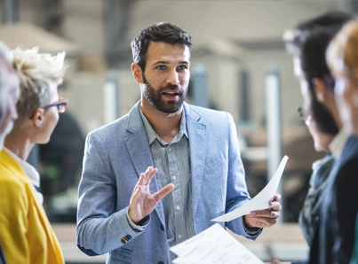 young business man leading group discussion