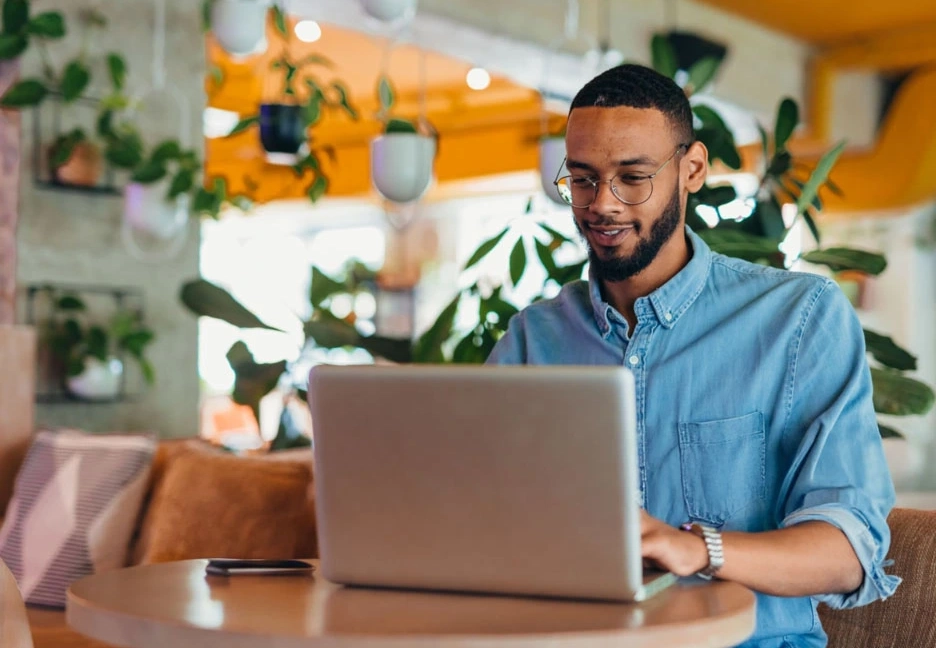 male college student studying on computer