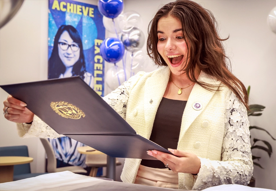 happy student with degree