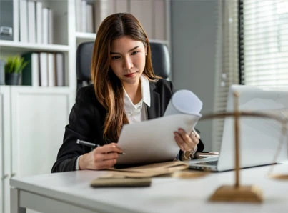 young female lawyer reading papers