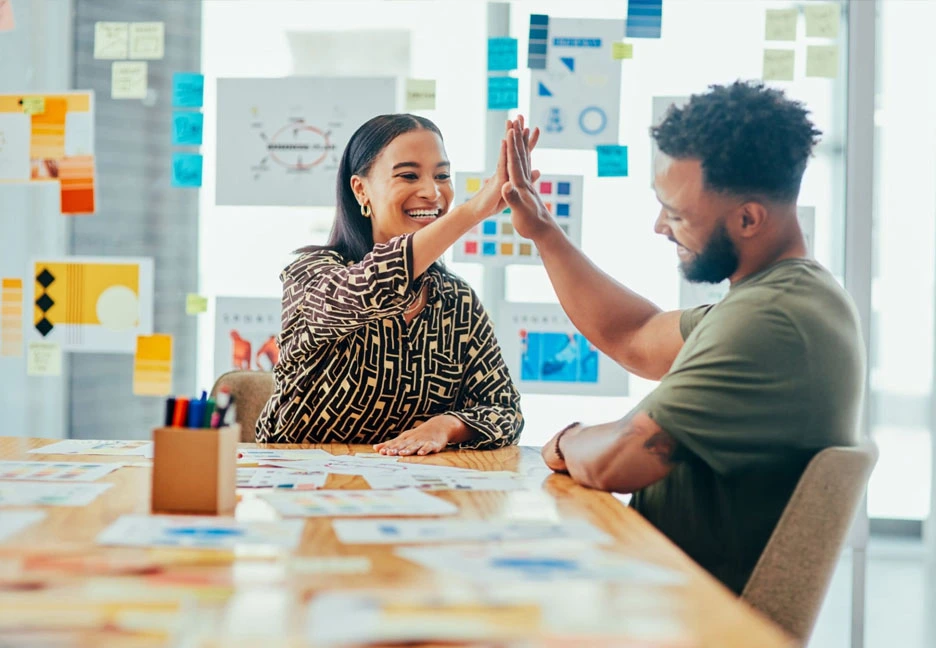 two marketers high-fiving
