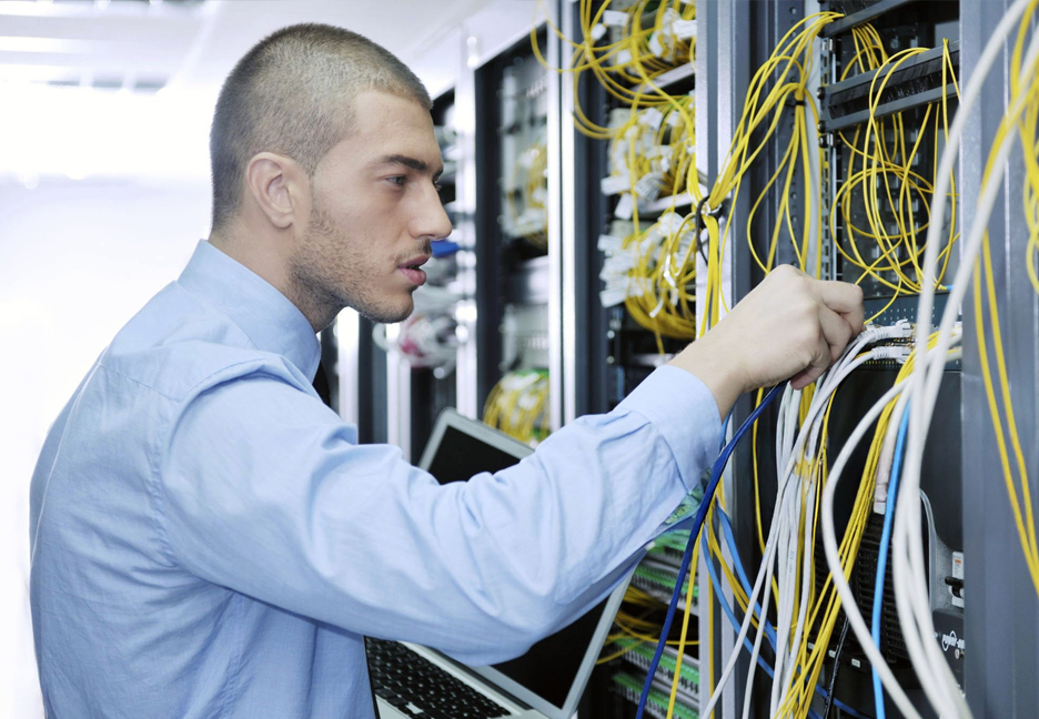 IT specialist working on a server