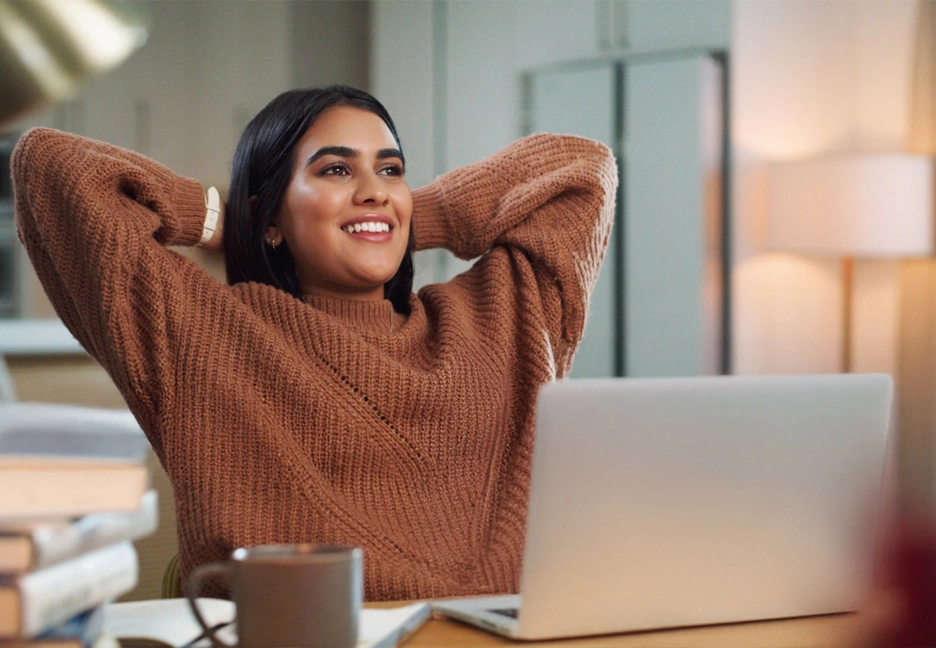 relieved woman on laptop