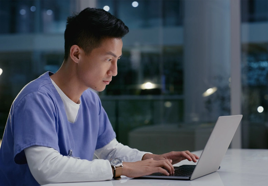 male nurse on laptop