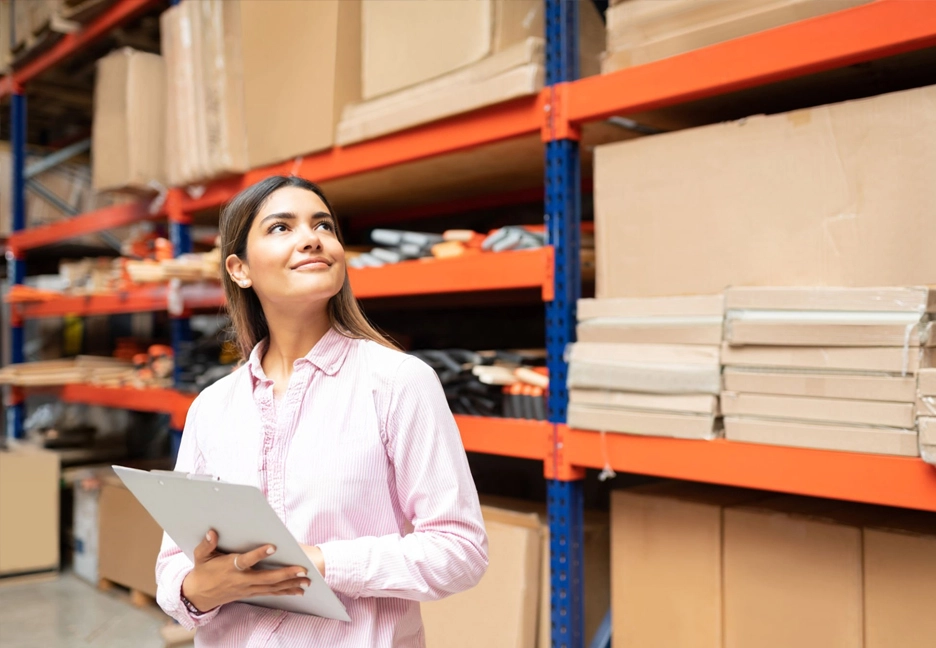 female supply chain manager looking at stock