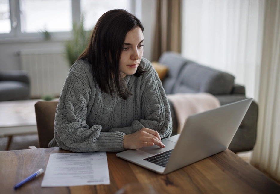 female student studying online at home