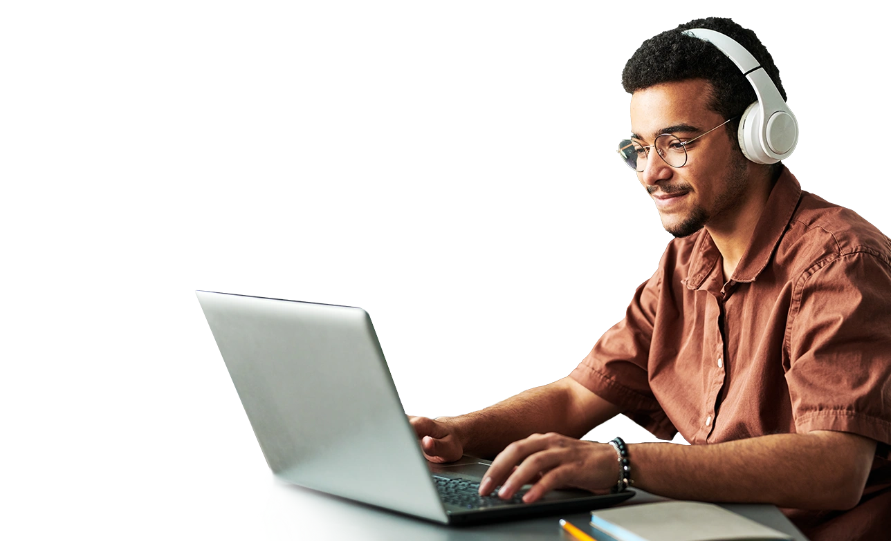 male student with headphones on laptop